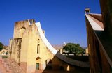 The Jantar Mantar is a collection of architectural astronomical instruments, built by Maharaja Sawai Jai Singh who was a Rajput king. The observatory consists of fourteen major geometric devices for measuring time, predicting eclipses, tracking stars' location as the earth orbits around the sun, ascertaining the declinations of planets, and determining the celestial altitudes and related ephemerides.<br/><br/>

Jaipur is the capital and largest city of the Indian state of Rajasthan. It was founded on 18 November 1727 by Maharaja Sawai Jai Singh II, the ruler of Amber, after whom the city was named. The city today has a population of 3.1 million. Jaipur is known as the Pink City of India.<br/><br/>

The city is remarkable among pre-modern Indian cities for the width and regularity of its streets which are laid out into six sectors separated by broad streets 34 m (111 ft) wide. The urban quarters are further divided by networks of gridded streets. Five quarters wrap around the east, south, and west sides of a central palace quarter, with a sixth quarter immediately to the east. The Palace quarter encloses the sprawling Hawa Mahal palace complex, formal gardens, and a small lake. Nahargarh Fort, which was the residence of the King Sawai Jai Singh II, crowns the hill in the northwest corner of the old city. The observatory, Jantar Mantar, is a World Heritage Site.